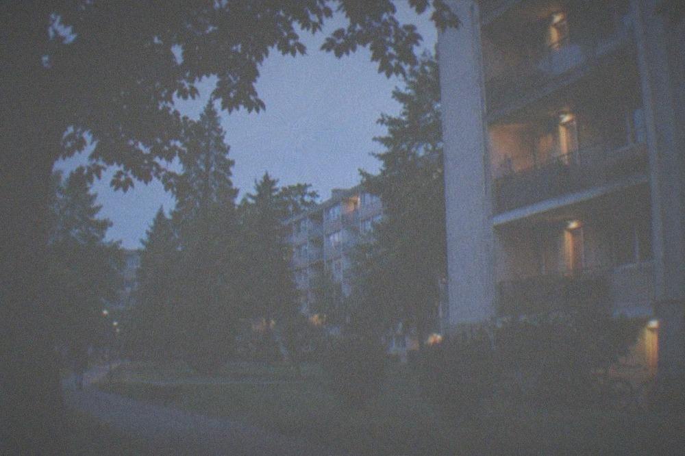 Evening light on dormitory balconies with bicycles parked below