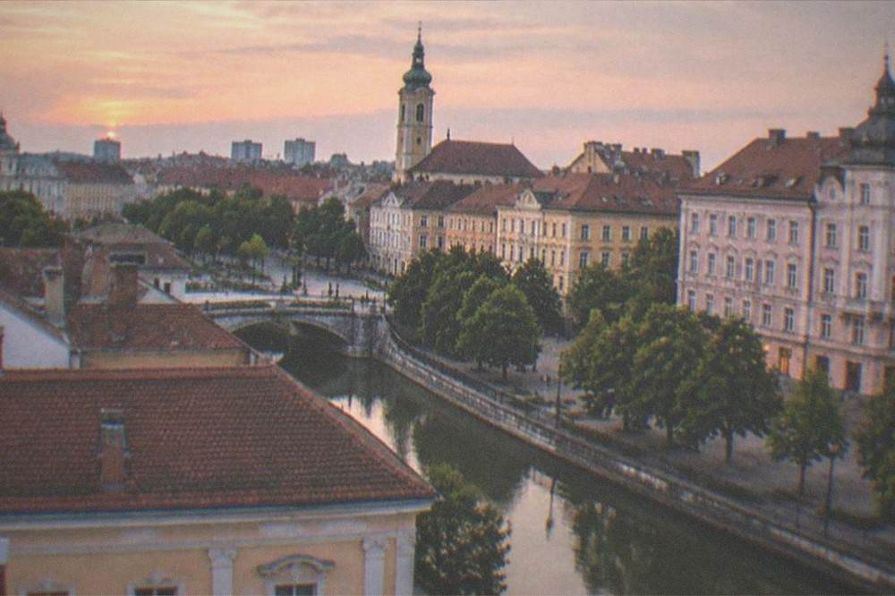 A view over Timisoara rooftops toward the city center at dusk