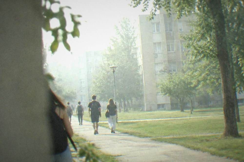 Students walking between dormitory buildings in the Complex Studentesc area of Timisoara