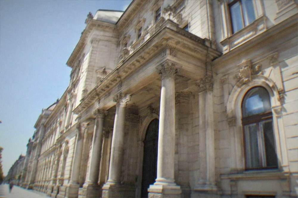 Ornate stone doorway and window detail on a grand historic public building