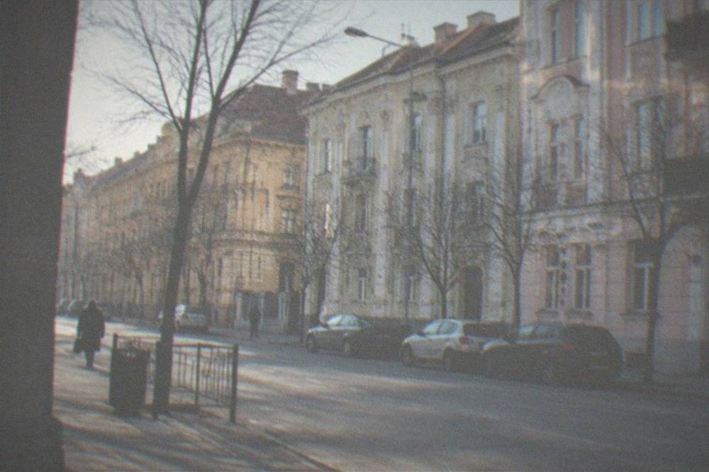 Pastel Secession apartment facades along a boulevard in the Fabric district