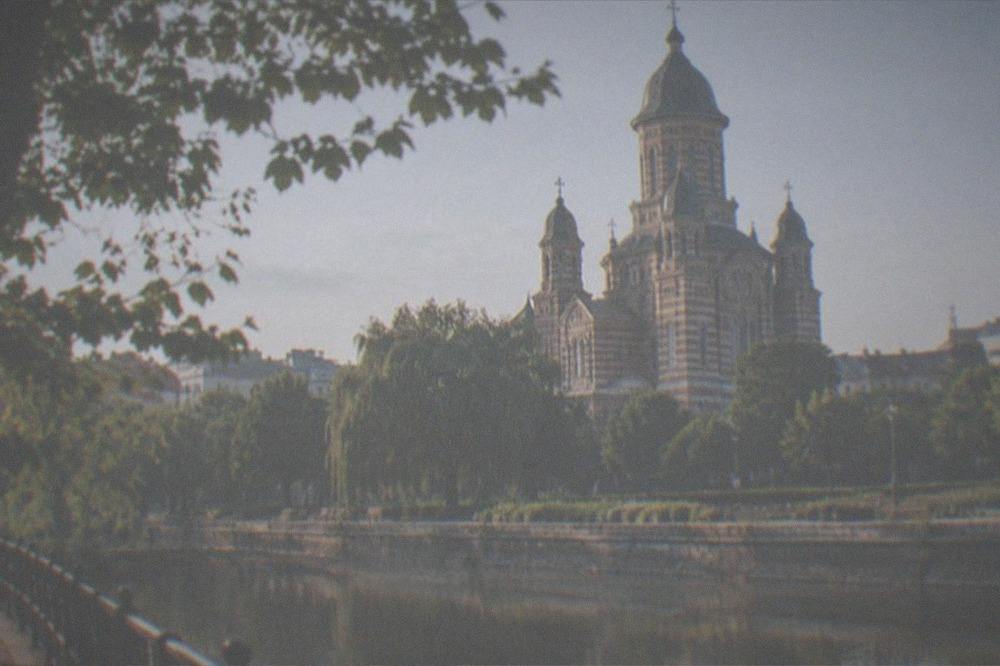 The Orthodox Metropolitan Cathedral dome seen from the riverside path near the castle