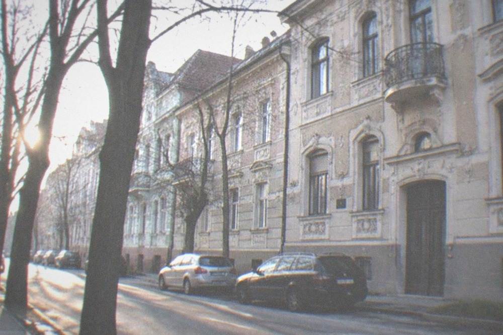 Historic apartment facades with ornate stucco on a street in Iosefin, Timisoara
