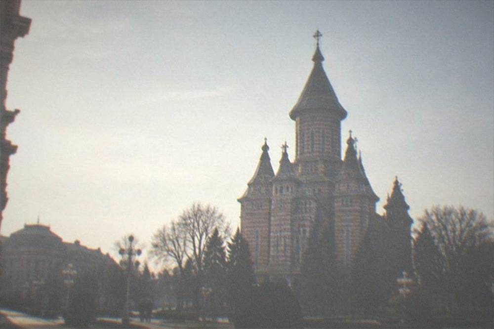 The domed Metropolitan Cathedral seen across the square from near the Opera
