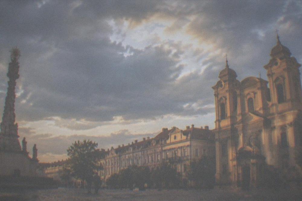 Evening light on the cathedral facade and the baroque buildings of Union Square