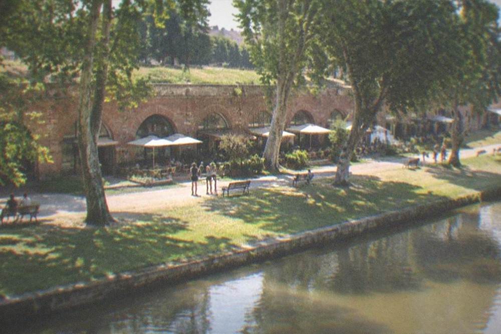 The bastion walls seen from the green park area beside the Bega canal in summer