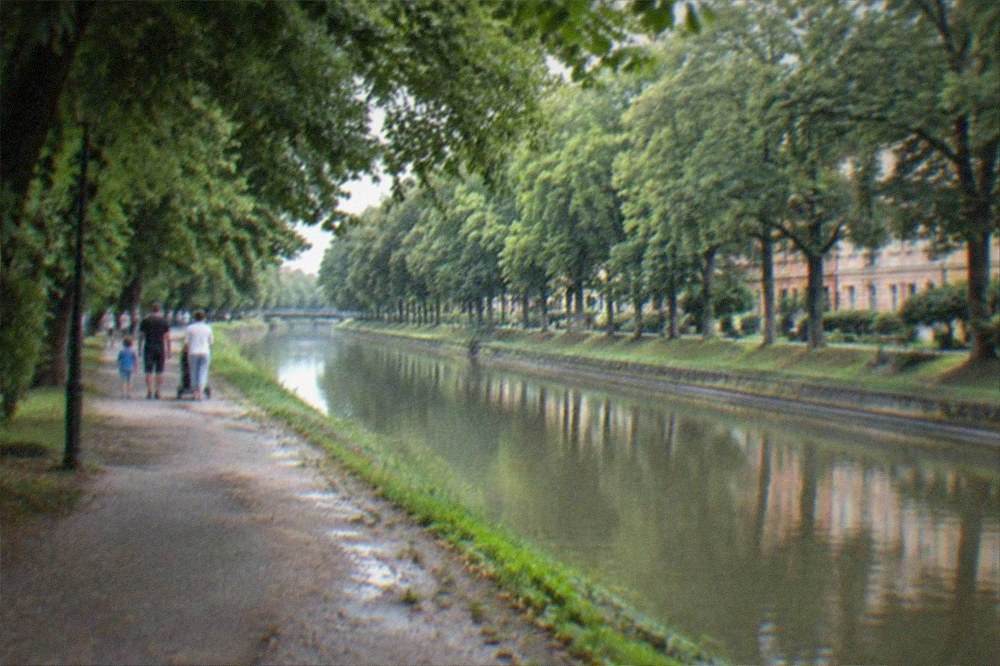 Families walking along the Bega canal promenade in Timisoara