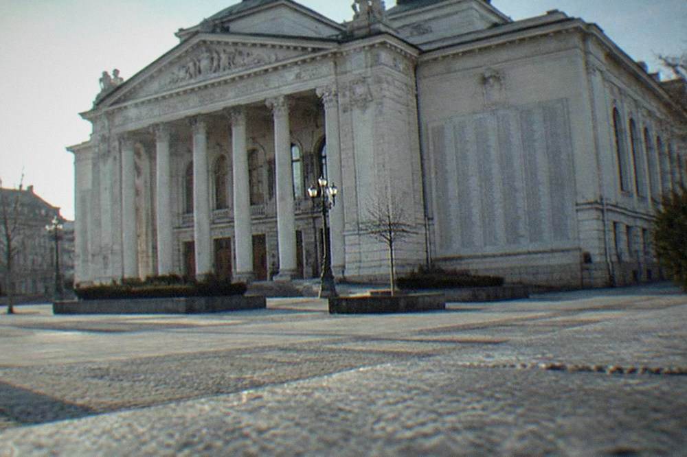 The Romanian National Opera building on Piata Victoriei with the 1989 memorial list of names on its wall