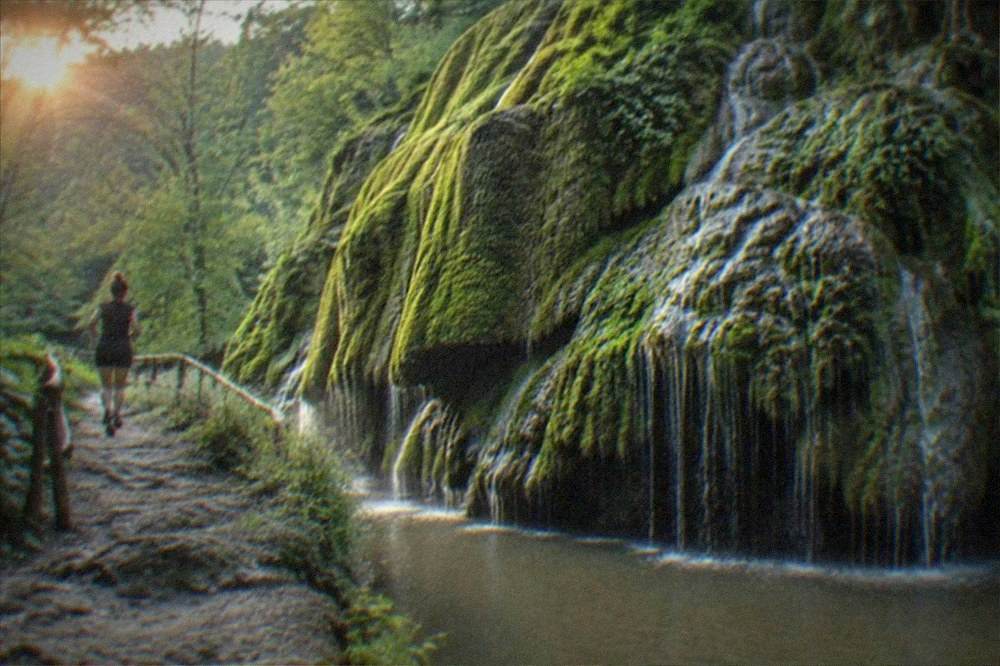 Colorful baroque buildings around a city square at dusk with people at outdoor tables