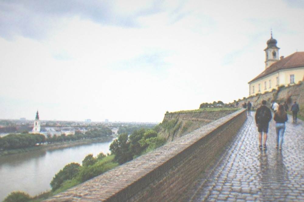 Visitors walking the ramparts of Petrovaradin Fortress above the Danube
