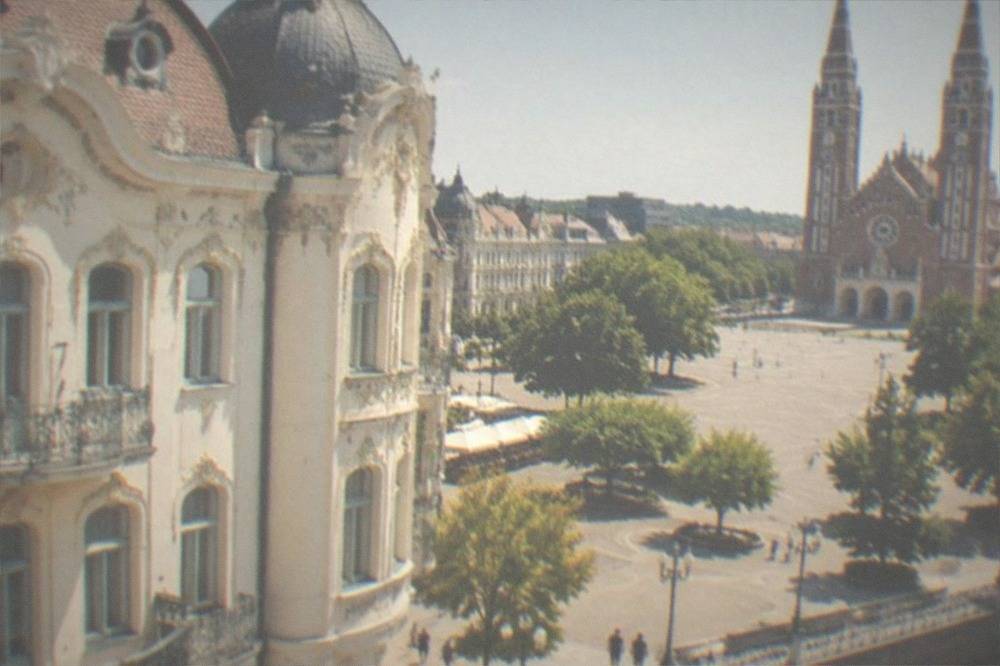 The ornate art nouveau facade of a city palace in Szeged with curved floral ironwork