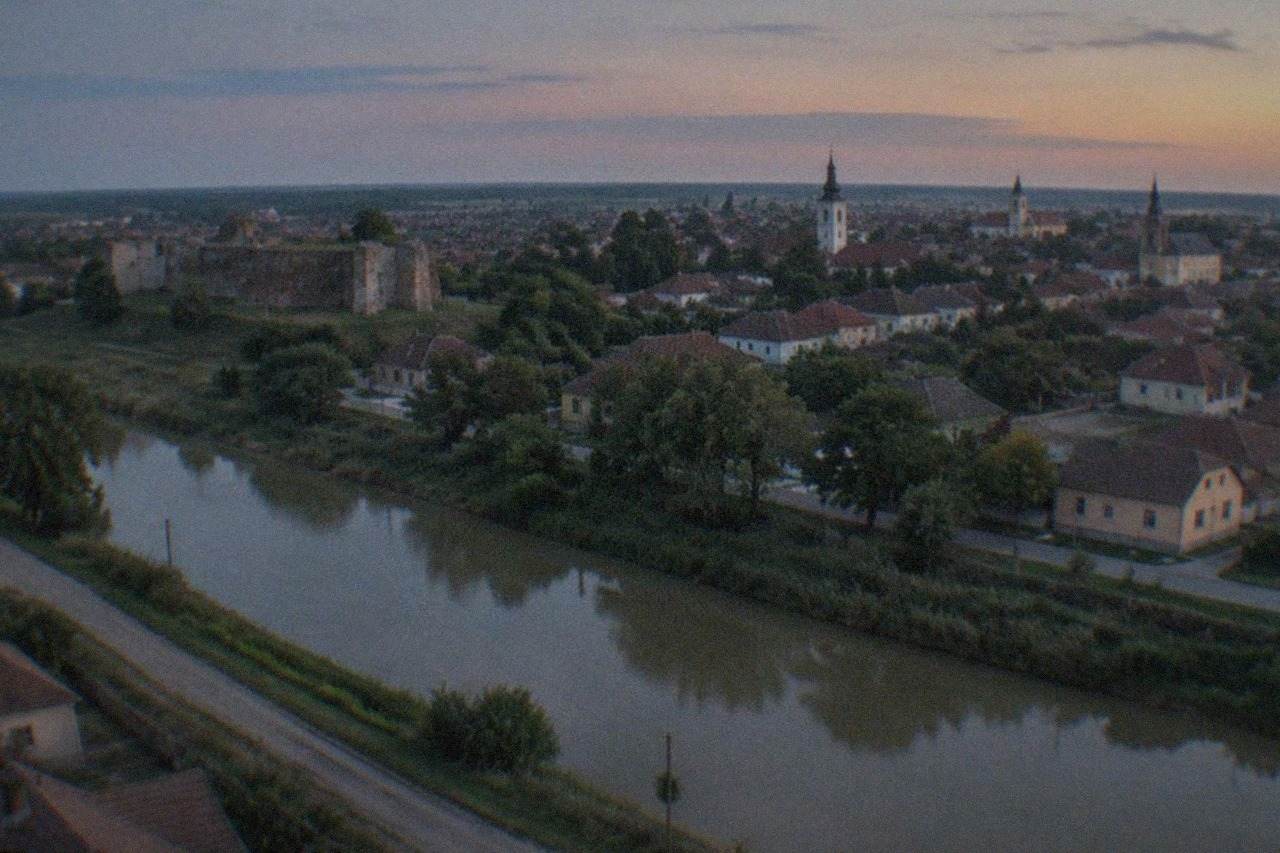 Panoramic view over Timisoara's rooftops and church towers at golden hour