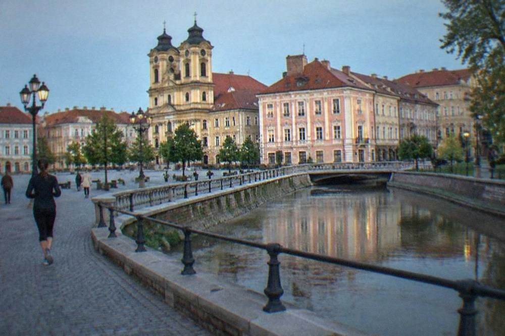 Baroque buildings and colorful facades around a large square in Timisoara