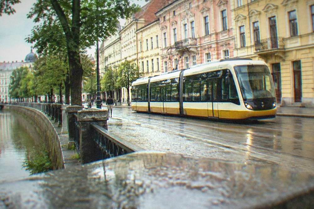 A modern tram passing colorful buildings on a Timisoara street