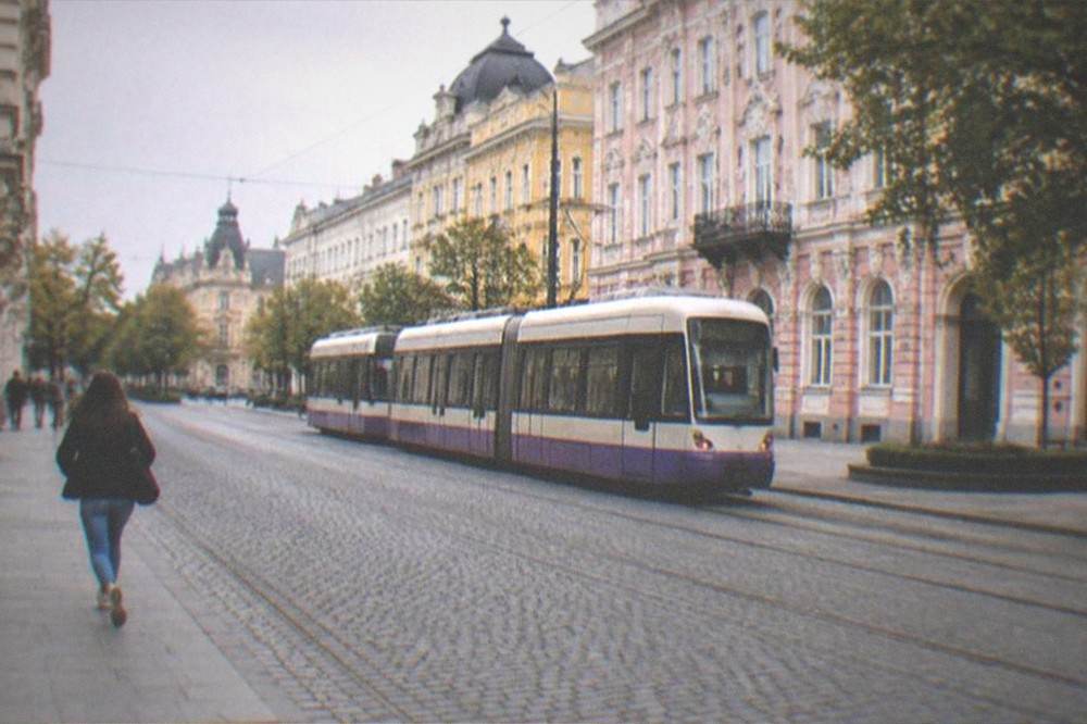 A tram passing colorful facades in central Timisoara near the old town