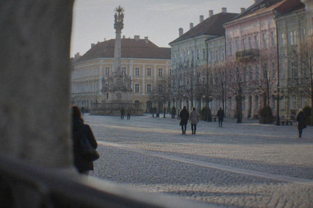 Wide view of Union Square in Timisoara with colorful baroque buildings and open pedestrian space