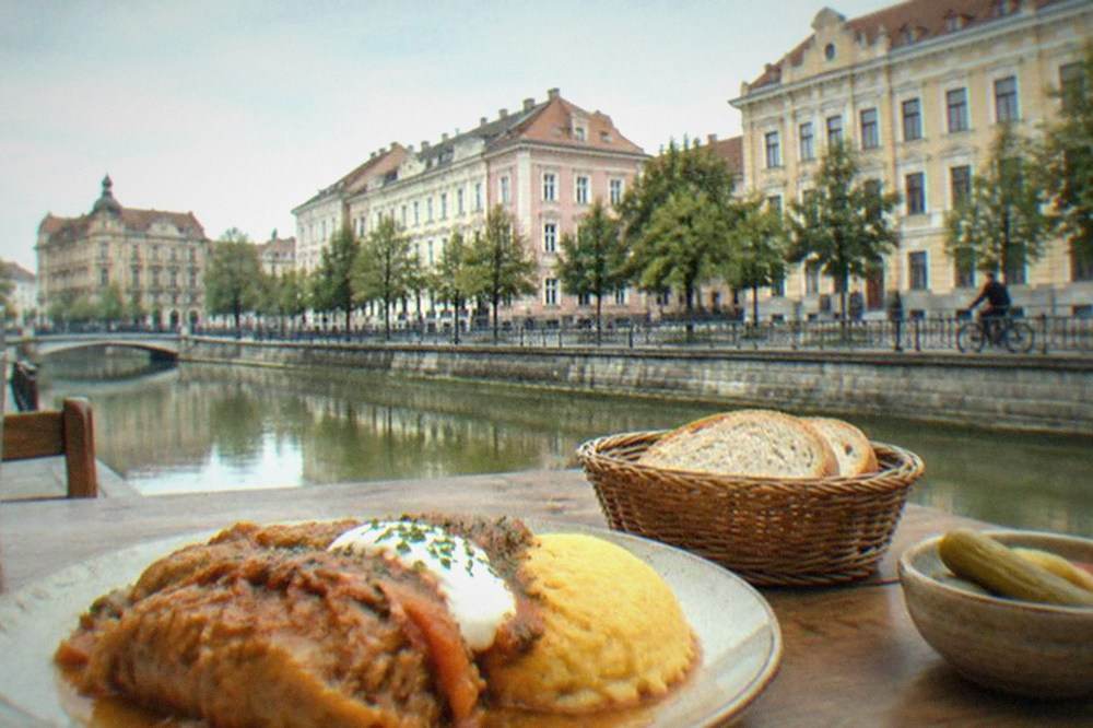 A plate of traditional Romanian food on a wooden table in a Timisoara restaurant
