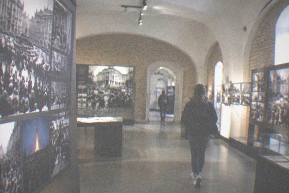 A museum interior with photographs and displays about the 1989 revolution
