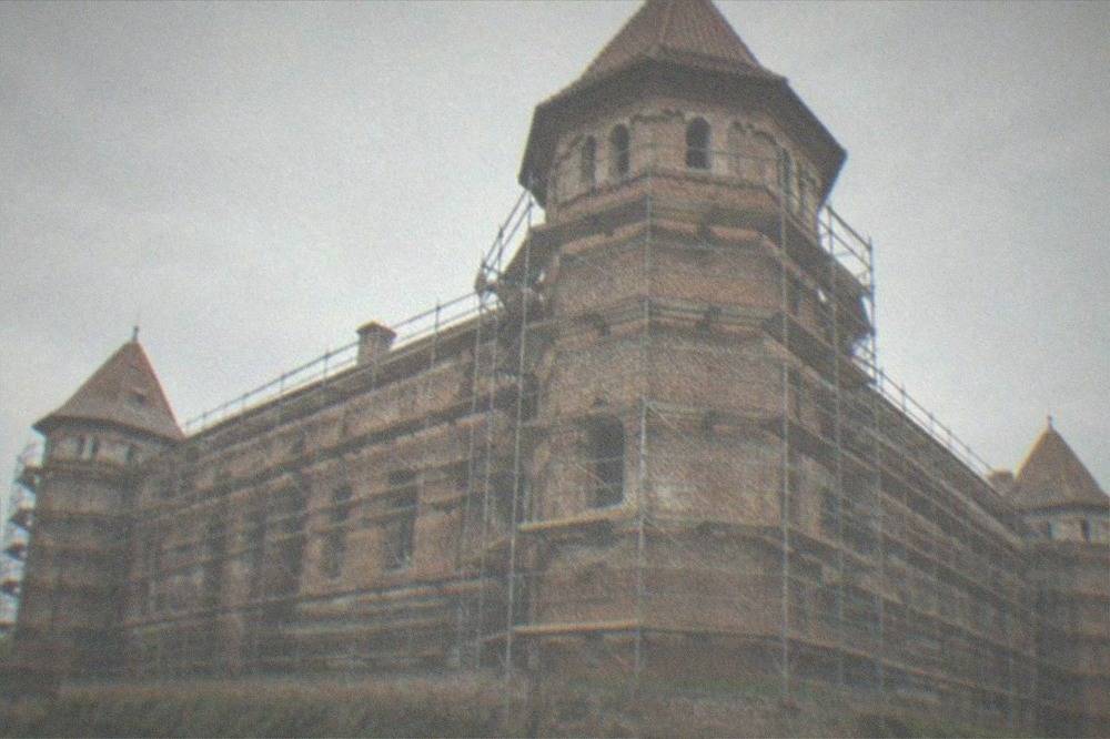 Scaffolded exterior of Huniade Castle in Timisoara during restoration works