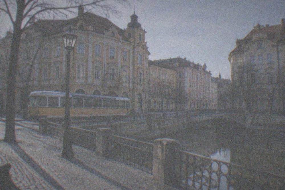 A tram passing historic buildings near the museums of central Timisoara