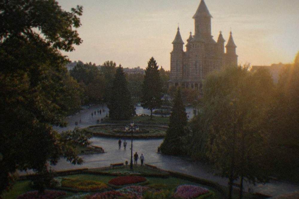 Flower beds and mature trees in Central Park near the Orthodox cathedral in Timisoara
