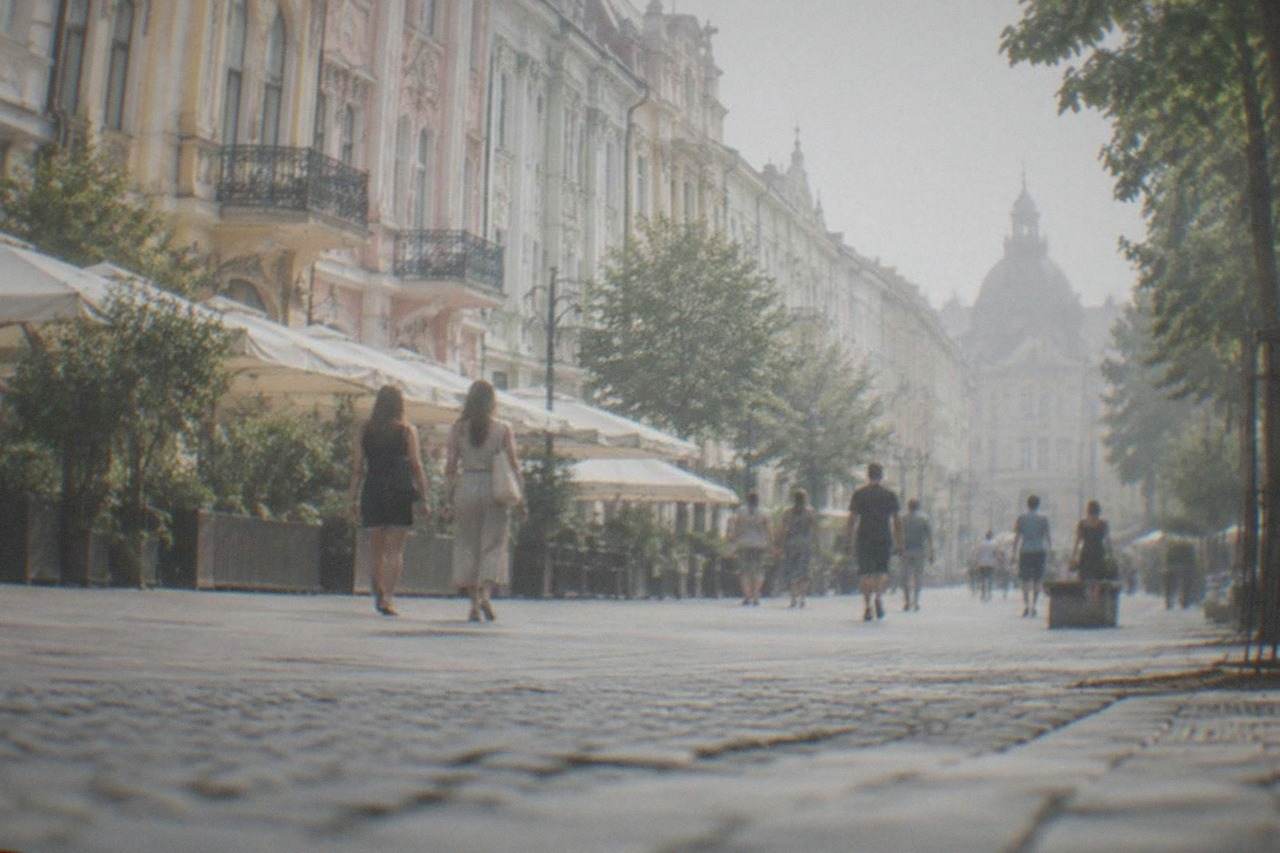 Shoppers walking past colorful historic buildings on a pedestrian street in Timisoara's old town
