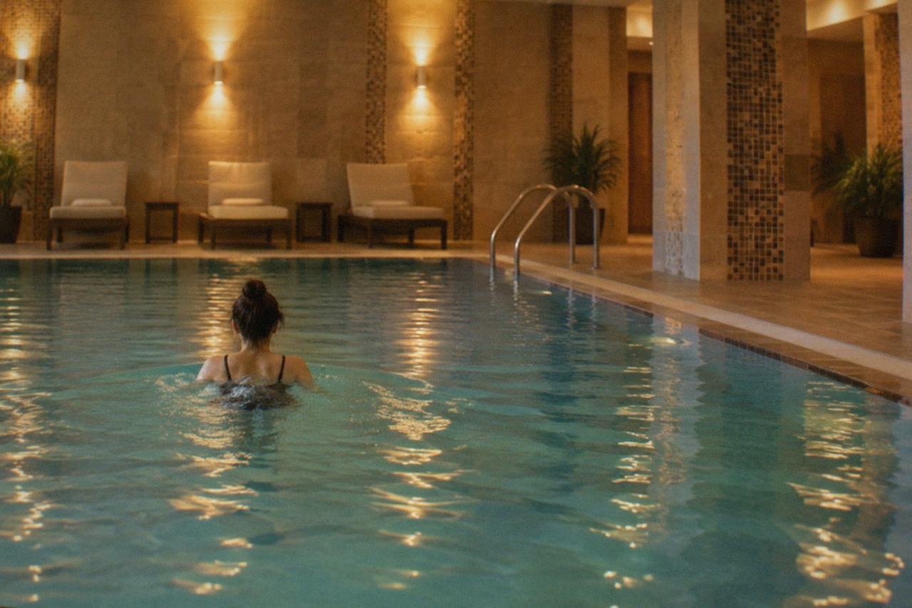 A calm hotel spa pool with warm lighting and tiled walls in Timisoara, Romania