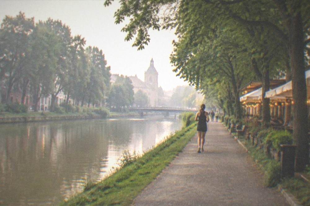 An evening terrace with warm lights beside the Bega canal in Timisoara