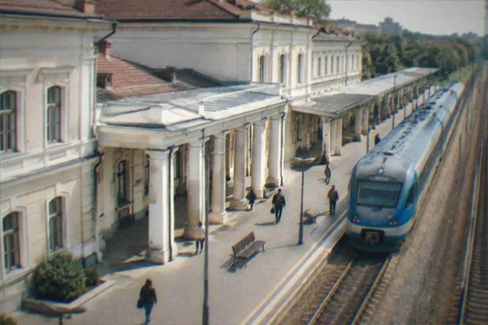 A regional train waiting at a platform of a European railway station