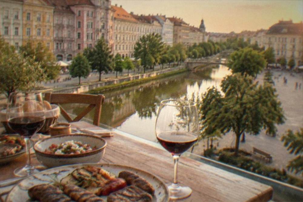 A rustic restaurant table with grilled meat dishes and local wine glasses