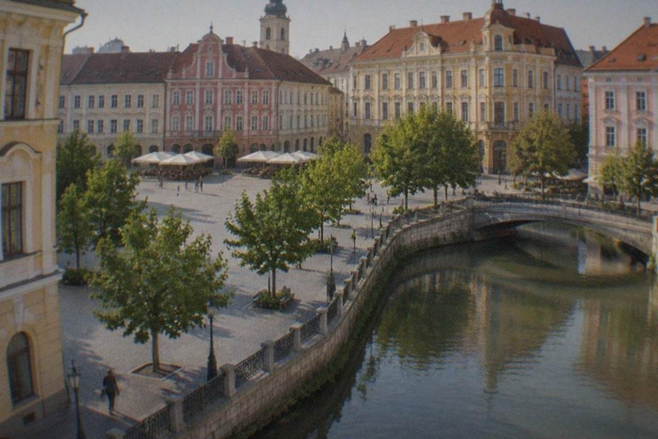 Colorful baroque facades around a public square in Timisoara on a bright morning