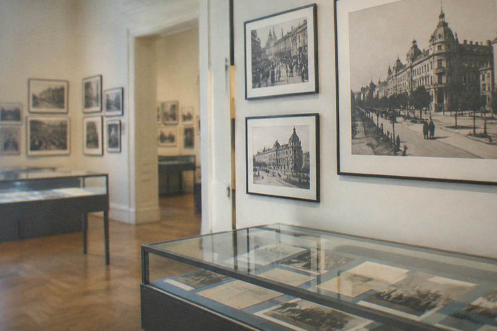 Museum interior with historical photographs and display cases