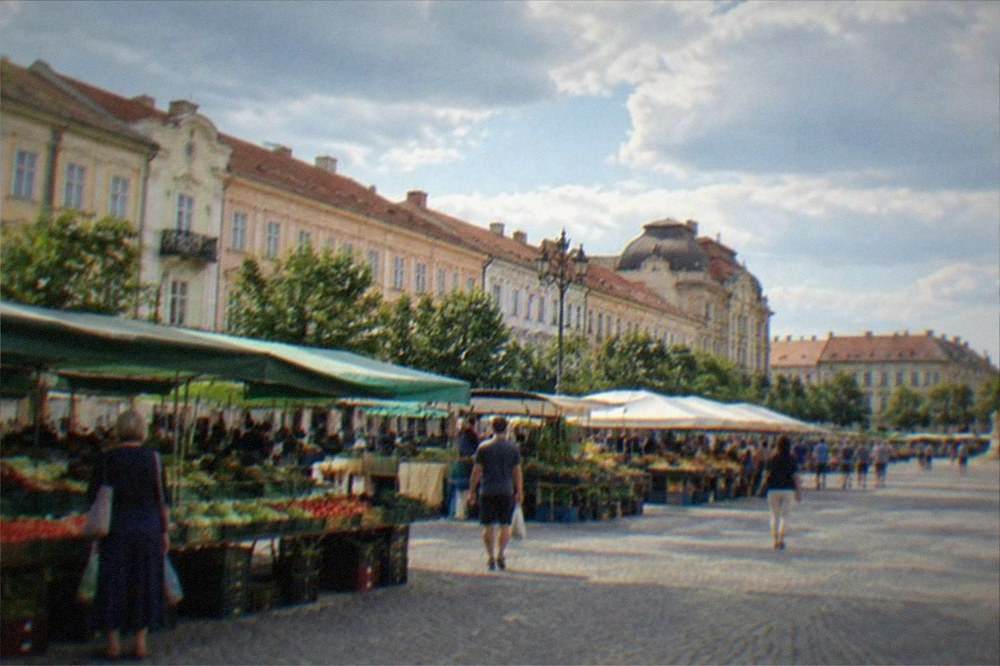 Central market hall interior with fresh produce stalls and shoppers