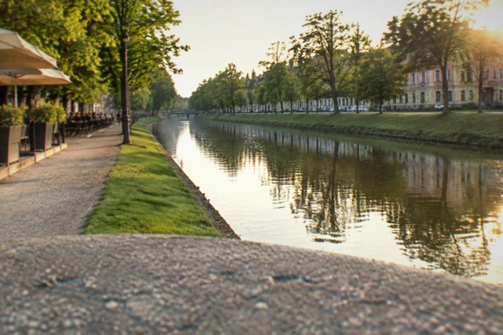 Terraces and evening light along the Bega canal promenade in Timisoara