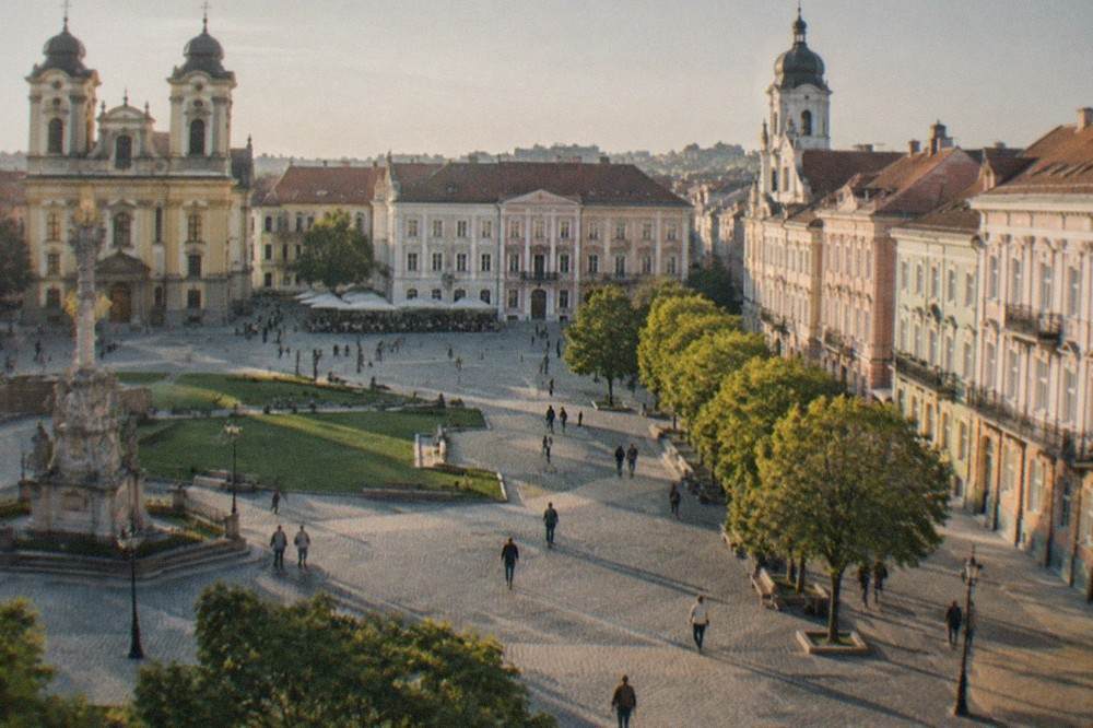 Pastel baroque facades and church domes around Piata Unirii in Timisoara